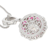 Sterling silver pendant with intricate design and pink accent, perfect for adding elegance to any outfit.